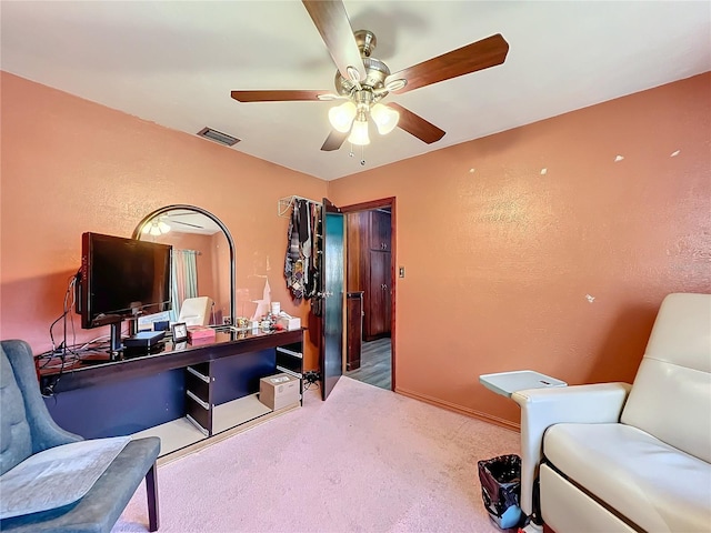 office area featuring ceiling fan and carpet