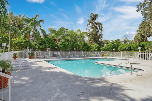 view of swimming pool with a patio