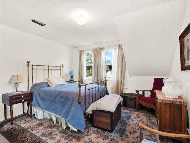 bedroom with lofted ceiling