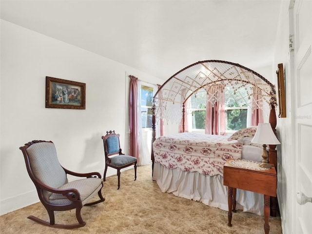 bedroom featuring light colored carpet