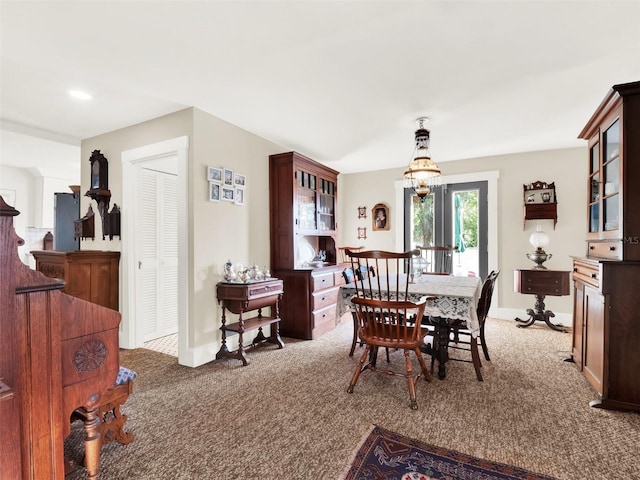 view of carpeted dining space