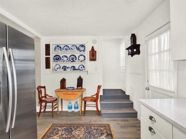 dining space with dark hardwood / wood-style flooring