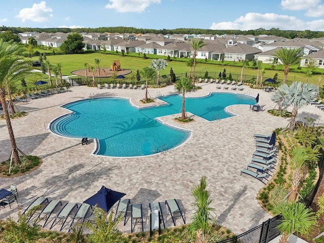 4110 Gooseberry Trl, Kissimmee, FL 34746 - community pool with a residential view and a patio area