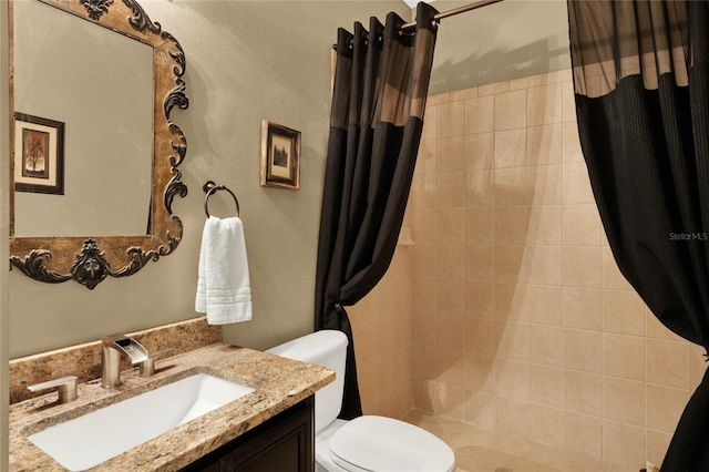 bathroom with vanity, toilet, and a shower with shower curtain