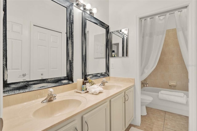 full bathroom with vanity, shower / tub combo, tile patterned floors, and toilet