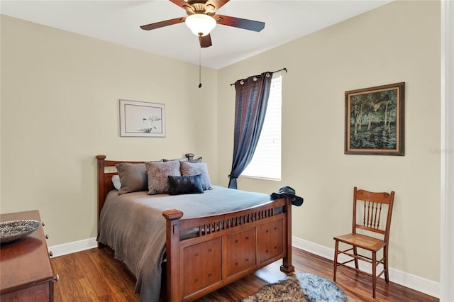 bedroom featuring dark hardwood / wood-style floors and ceiling fan