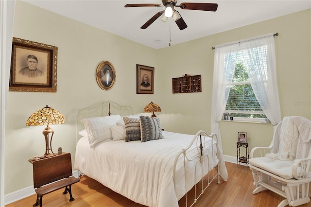 bedroom with ceiling fan and light wood-type flooring