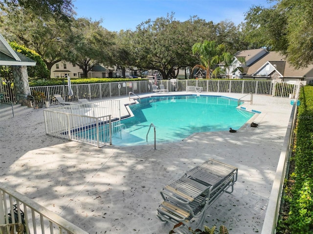 view of swimming pool with a patio