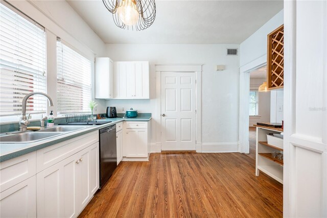 kitchen with sink, light hardwood / wood-style flooring, dishwasher, a wealth of natural light, and white cabinets