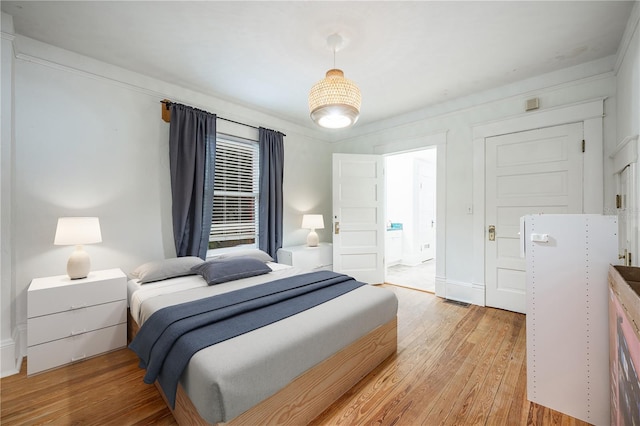 bedroom with light hardwood / wood-style flooring