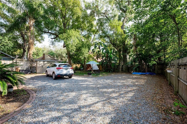 view of car parking featuring an outdoor structure