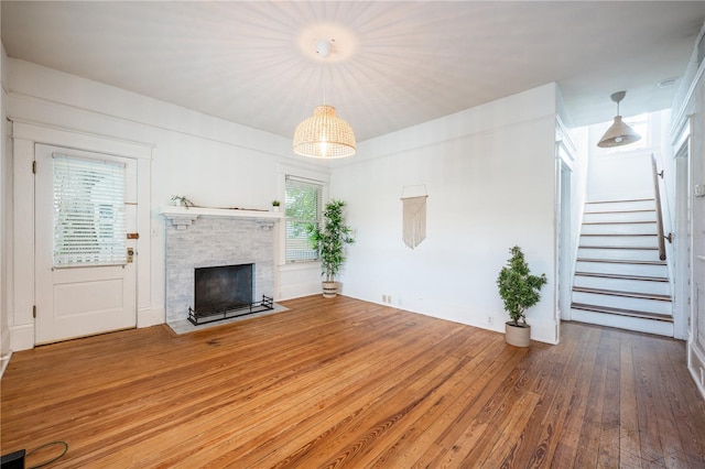 unfurnished living room featuring hardwood / wood-style flooring