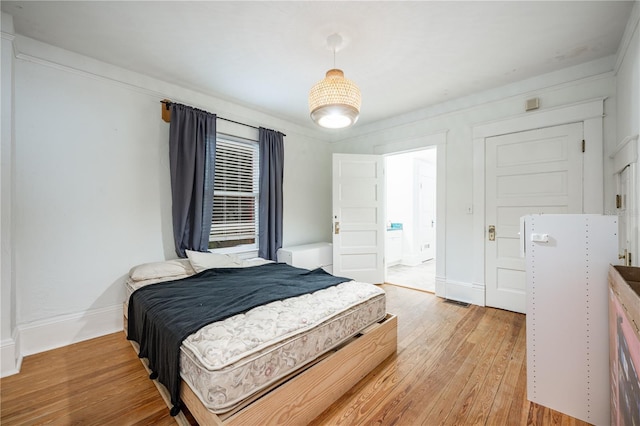 bedroom with light hardwood / wood-style floors