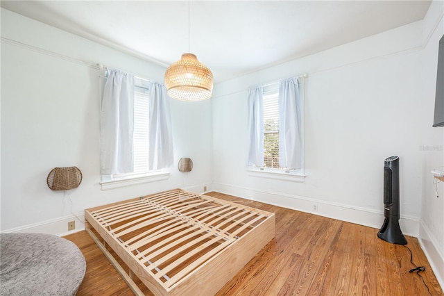 bedroom featuring hardwood / wood-style flooring