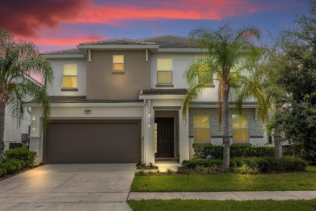 mediterranean / spanish house with a garage