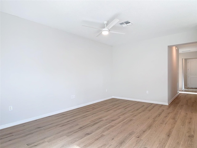 empty room featuring ceiling fan and light wood-type flooring