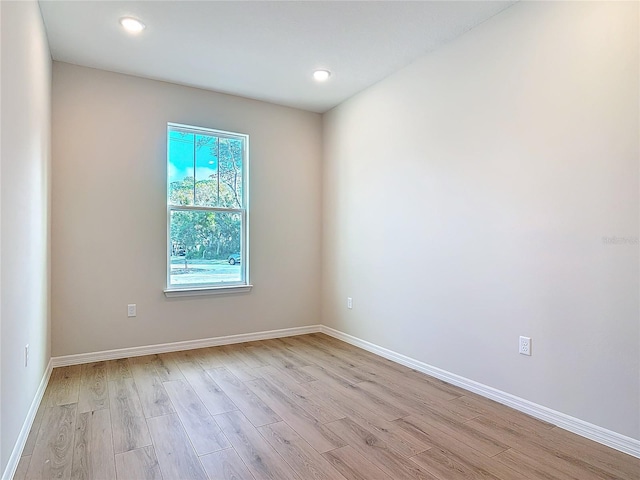 spare room featuring light hardwood / wood-style flooring