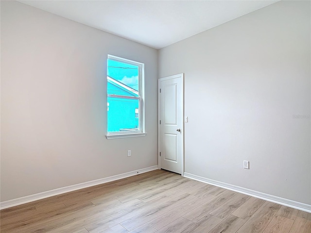 unfurnished room featuring light hardwood / wood-style floors