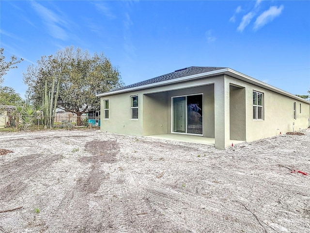 rear view of property featuring a patio area