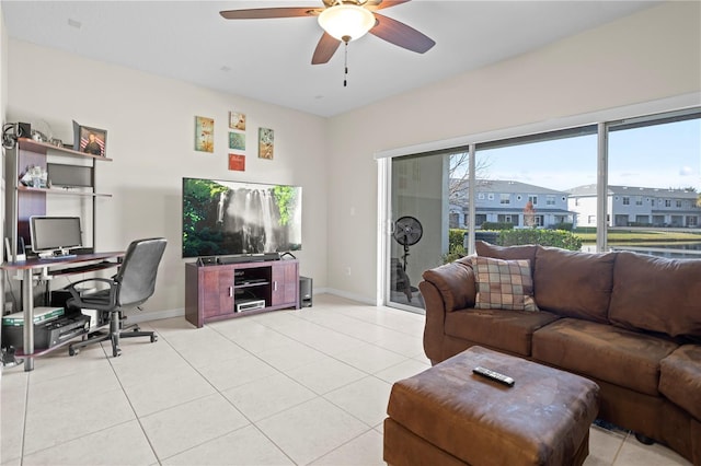 living room with light tile patterned floors and ceiling fan