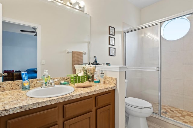 bathroom with vanity, toilet, and walk in shower