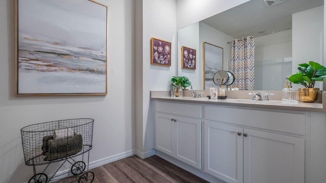 bathroom with vanity and hardwood / wood-style floors