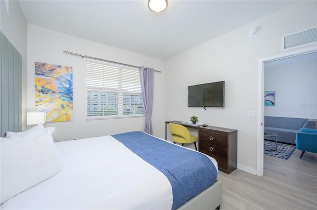 bedroom with light hardwood / wood-style floors