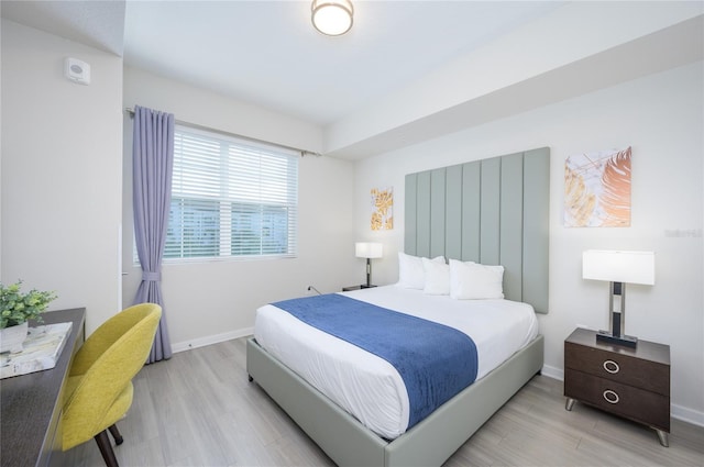 bedroom with light hardwood / wood-style flooring