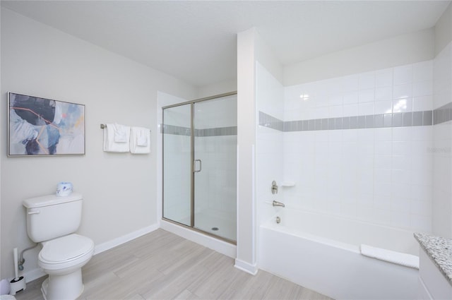 full bathroom featuring vanity, hardwood / wood-style flooring, toilet, and separate shower and tub