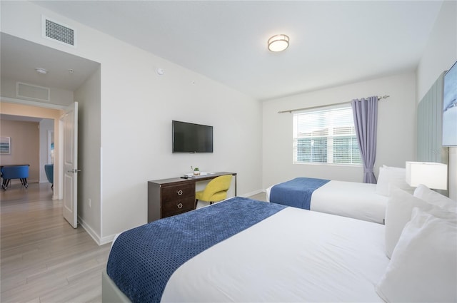 bedroom featuring light hardwood / wood-style floors