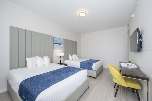 bedroom featuring light wood-type flooring