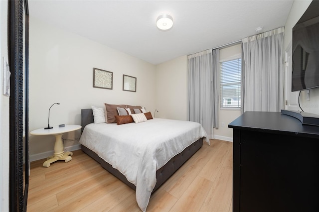 bedroom with light hardwood / wood-style floors