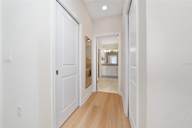 corridor featuring light wood-type flooring