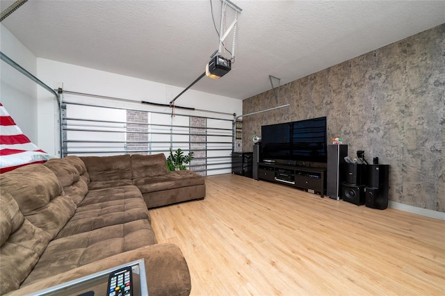 living room with wood-type flooring and a textured ceiling