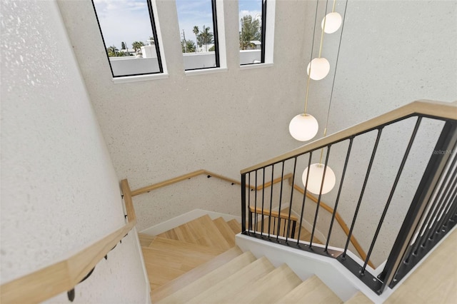 stairs featuring hardwood / wood-style flooring