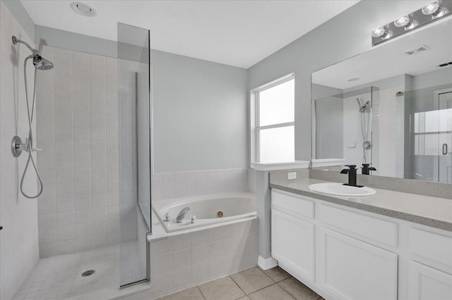 bathroom featuring tile patterned floors, independent shower and bath, and vanity