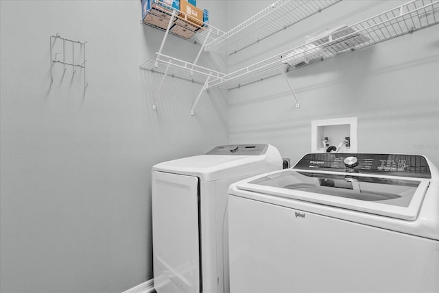 laundry area with washing machine and clothes dryer