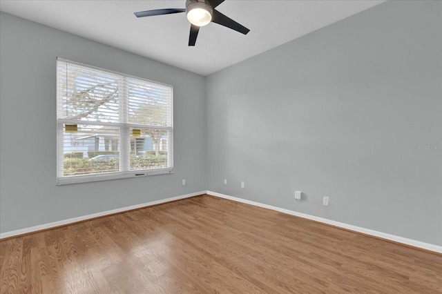 empty room with ceiling fan and light wood-type flooring