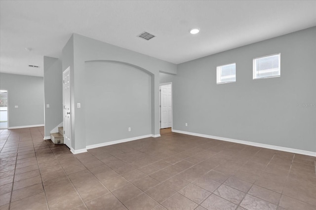 spare room with tile patterned floors