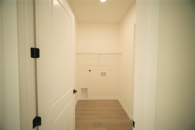 clothes washing area featuring hookup for an electric dryer, hookup for a washing machine, and light hardwood / wood-style floors