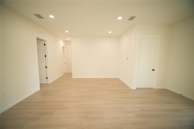 unfurnished room with light hardwood / wood-style floors