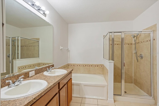 full bathroom with a sink, a garden tub, a stall shower, and tile patterned flooring