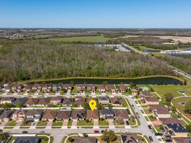 bird's eye view featuring a residential view and a water view