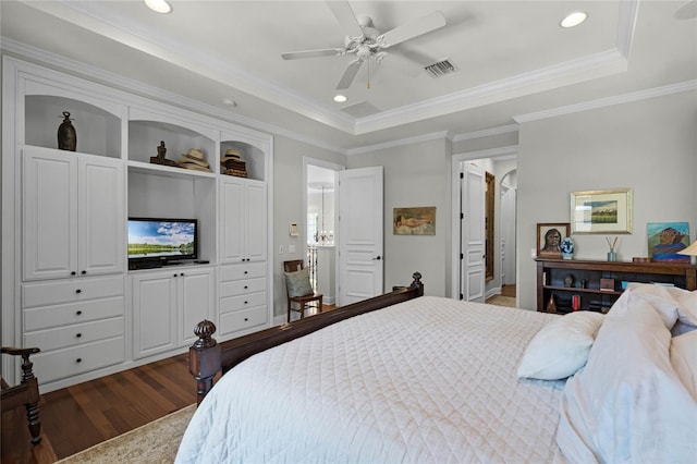 bedroom with crown molding, ceiling fan, dark hardwood / wood-style flooring, and a raised ceiling