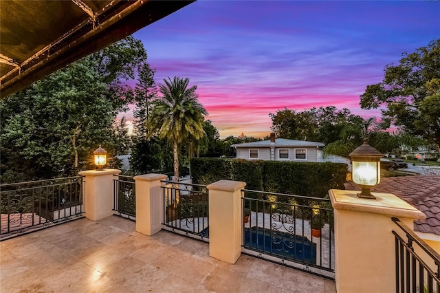 view of patio terrace at dusk