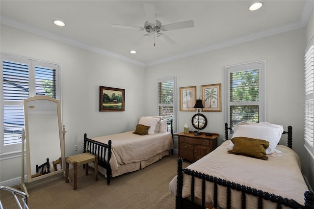 carpeted bedroom with crown molding, ceiling fan, and multiple windows