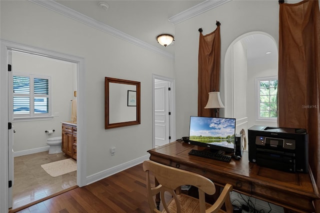 office with ornamental molding and light wood-type flooring