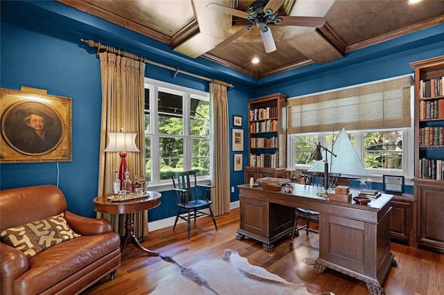 office with coffered ceiling, crown molding, wood-type flooring, beamed ceiling, and ceiling fan