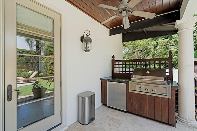 view of patio featuring an outdoor kitchen, a grill, and ceiling fan