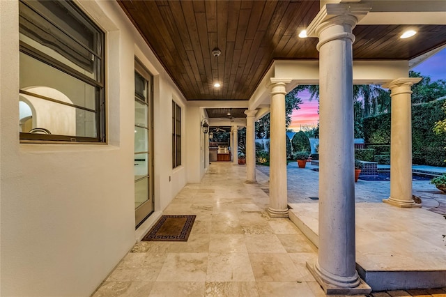 view of patio terrace at dusk